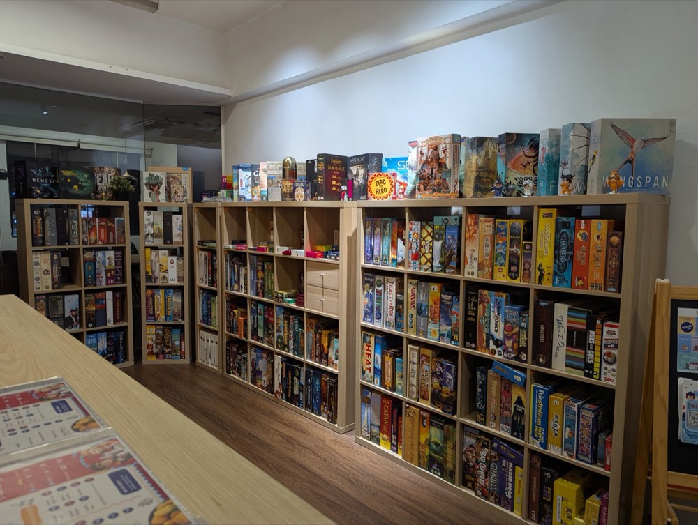 Shelves packed with board games at Hexabox